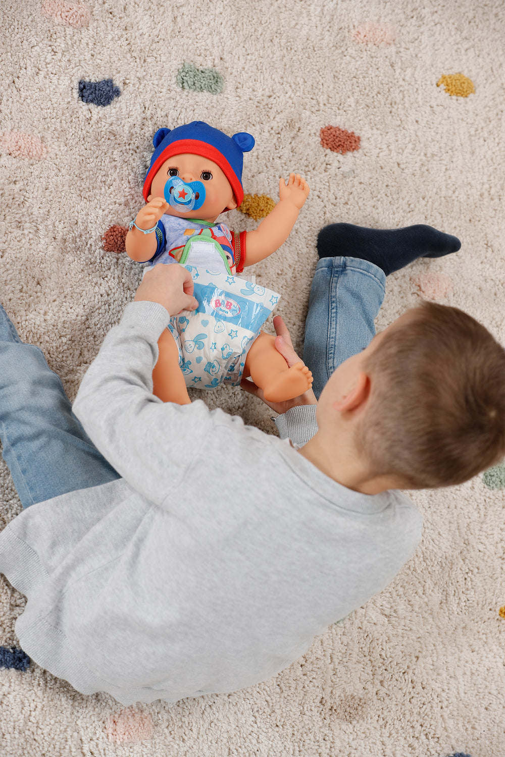 Poupon - BABY BORN - Jonas - 10 fonctions réalistes - 10 accessoires - Bleu et Rouge - 43cm - Des 3 ans