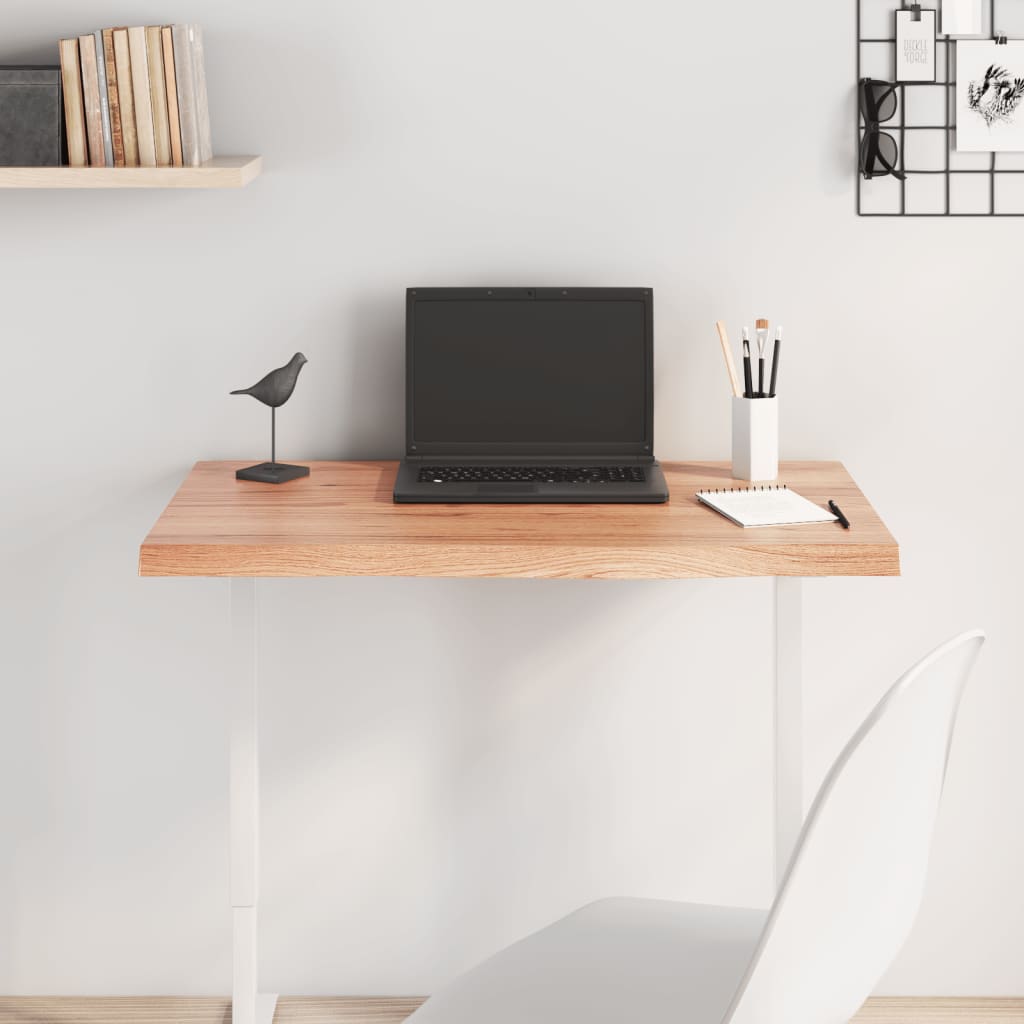 Light brown table top in treated solid oak wood