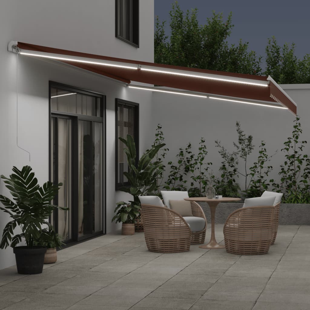 Manual retractable awning with LED brown 600x300 cm