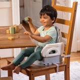 INGENUITY Rehausseur de chaise deluxe pliable gris, nomade avec tablette et sangles inclus