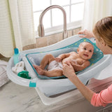 INGENUITY Baignoire bébé évolutive, grand confort, extra-large avec transat bébé hamac en tissu doux, jusqu'a 24 mois