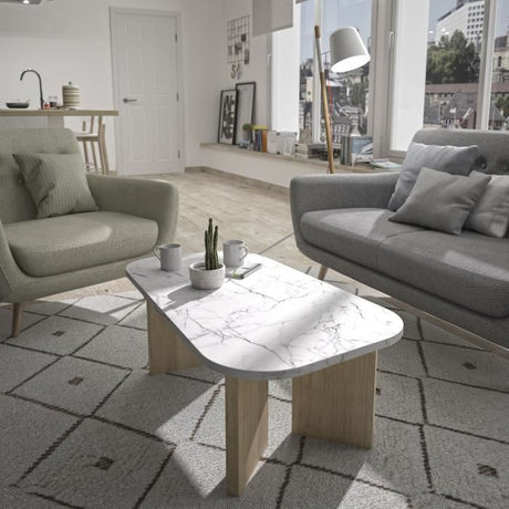 Table basse ovale - QUARTZ - Blanc effet marbre - Pieds épais en chene - 105 x 58 x 39 cm - DIAGONE