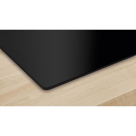 Table induction 60 cm - Bosch Série 2 - 3 foyers - Noir - Touch Select - H5,1 x L59,2 x P52,2 cm - PUC611AA5E